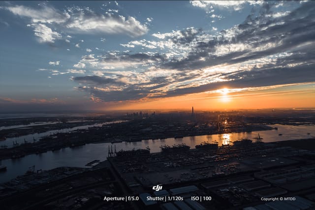Drone view of sunset over Bohai Bay and Dongjiang Port