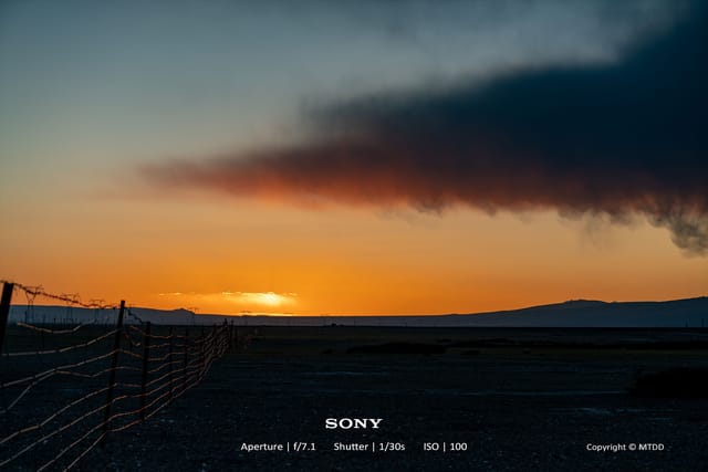 Sunset landscape near Mount Kailash with golden clouds over Highway 219